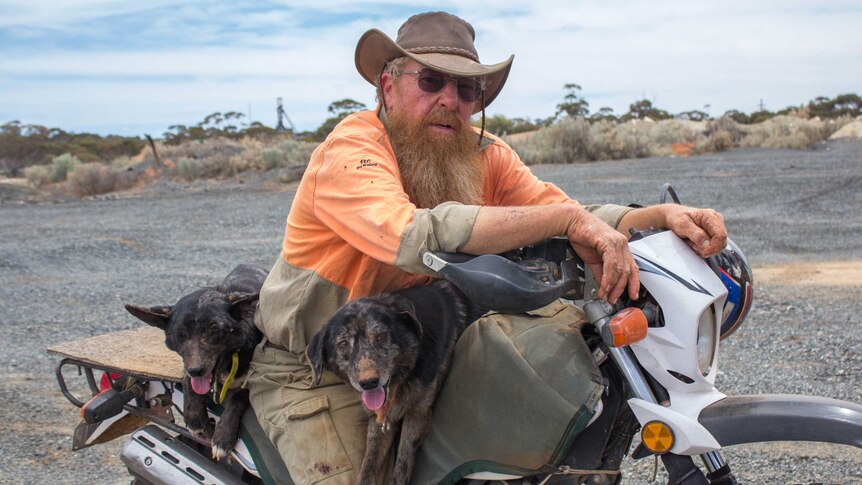Image of Paul Hansen sitting on a motorbike to the east of Kambalda.