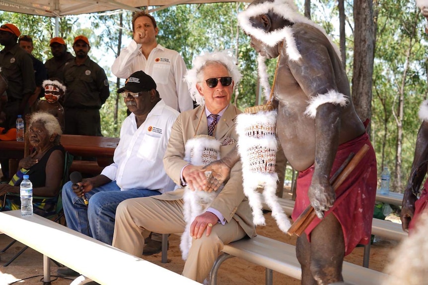 Prince Charles shakes hands with traditional owners in Nhulunbuy.