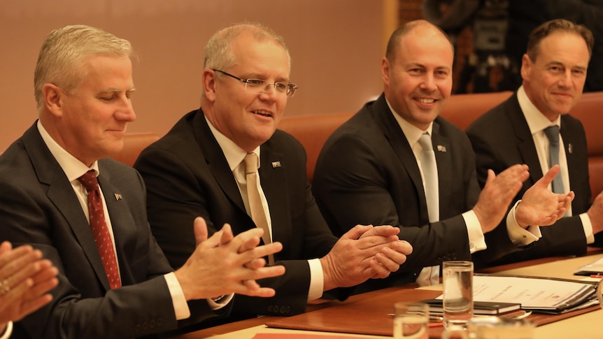 Michael McCormack, Scott Morrison, Josh Frydenberg and Greg Hunt sit in the Cabinet room