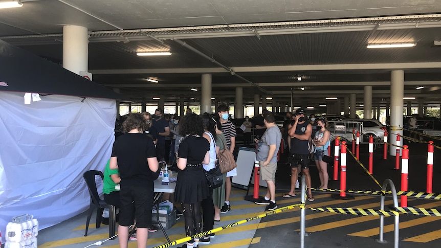 People line up for the COVID-19 vaccination at a Bunnings in Logan.