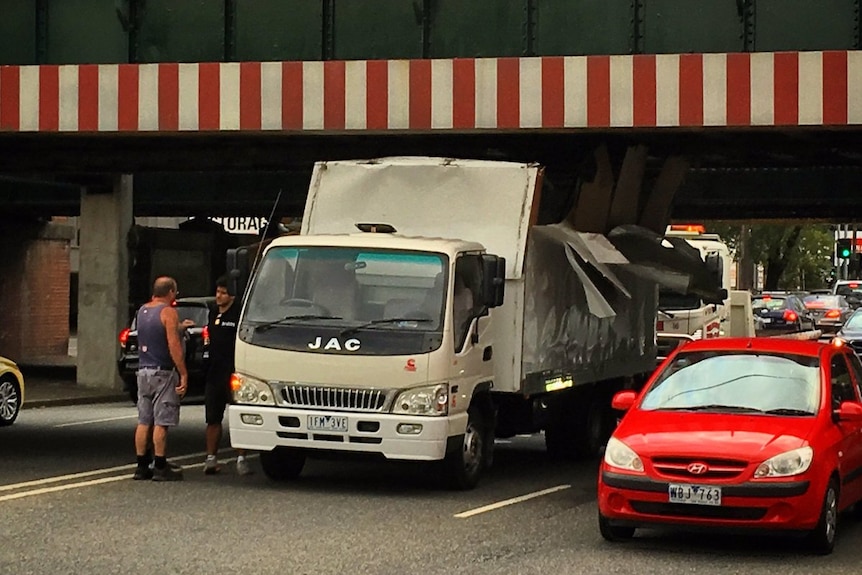 A truck under the Montague St bridge in Melbourne.
