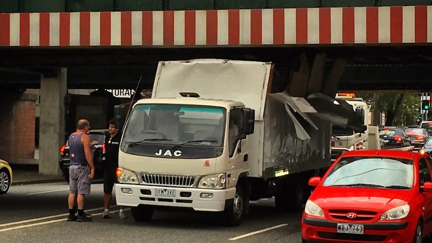 A truck under the Montague St bridge in Melbourne.