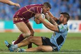 The Blues' James Tamou tackles the Maroons' Corey Parker in Origin I.