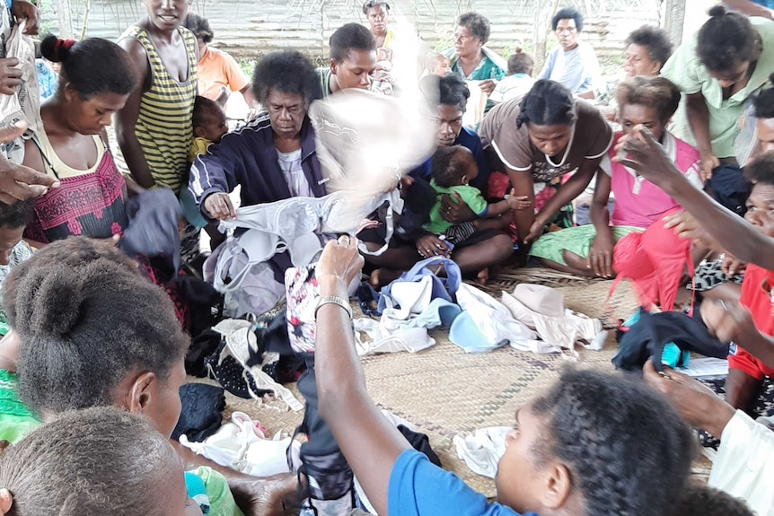 Women sorting through bras in the remote island of Futuna Vanuatu