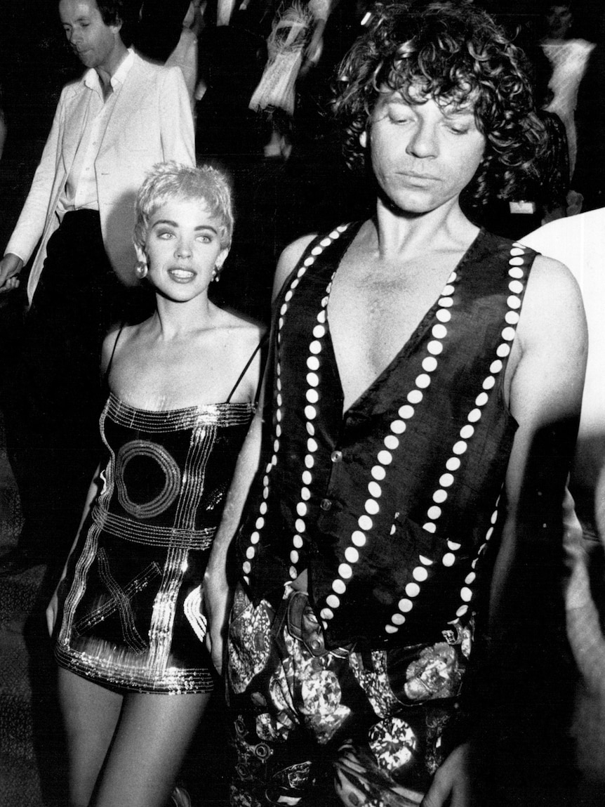 Kylie Minogue and Michael Hutchence in extravagant outfits