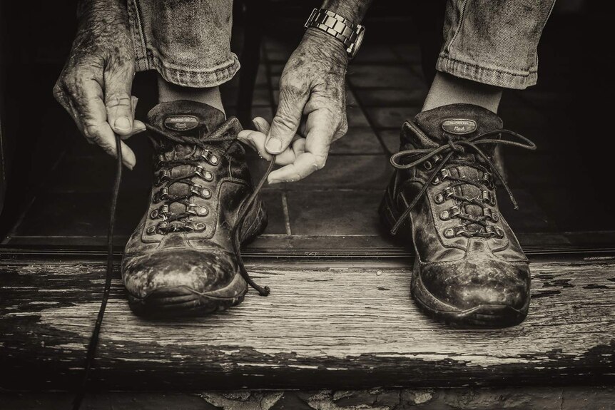 A photograph of David Hill tying his shoes won third prize in the competition.