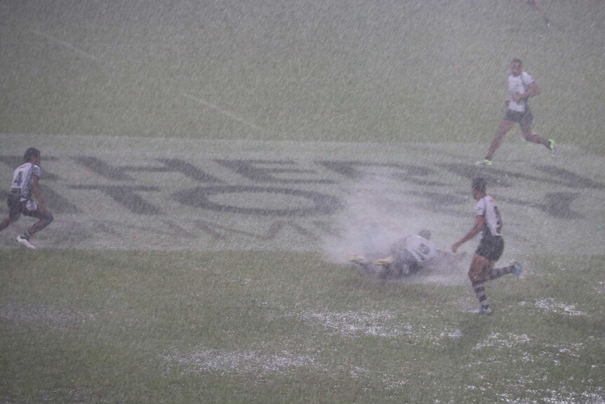 Rugby Sevens play in monsoon conditions