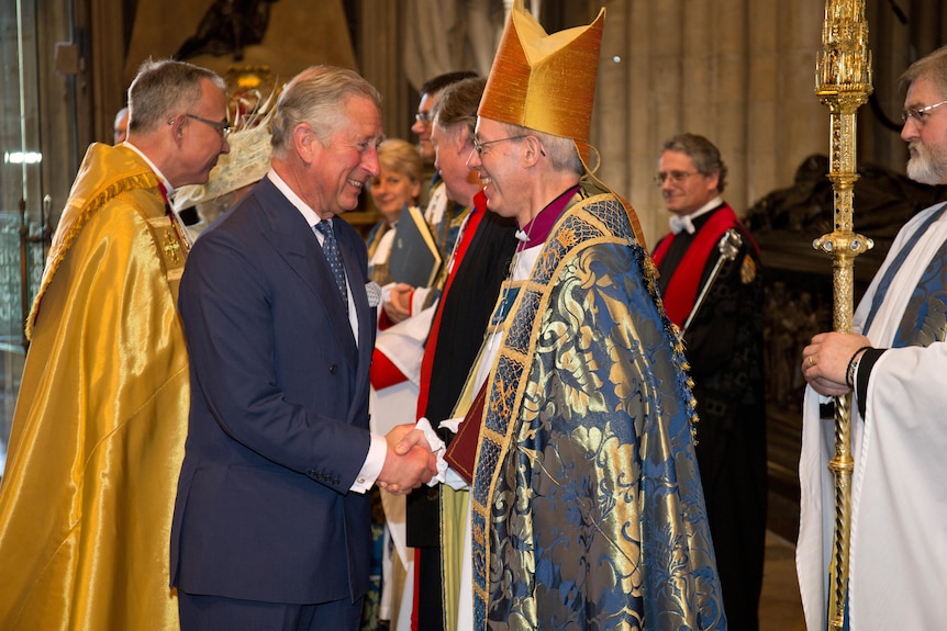 King Charles shaking hands with Archbishop Justin Welby.