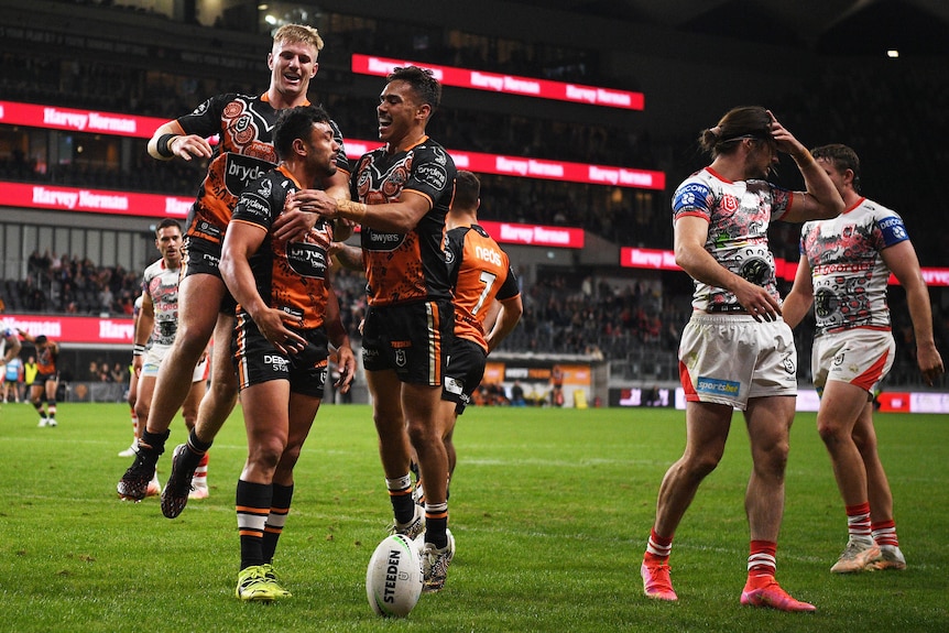 Wests Tigers celebrate try against Dragons