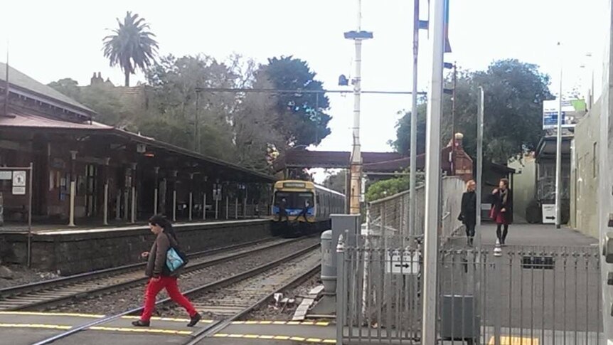 Unidentified teens coupler riding at Middle Brighton train station in Melbourne on July 11, 2014.