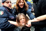 Topless feminist arrested after trying to confront Silvio Berlusconi
