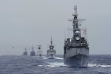 Kee Lung (DDG-1801) guided-missile destroyer (R) and navy vessels take part in a military drill near Hualien