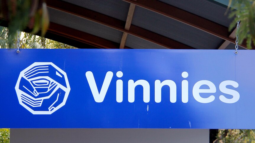 A Vinnies sign outside a store.