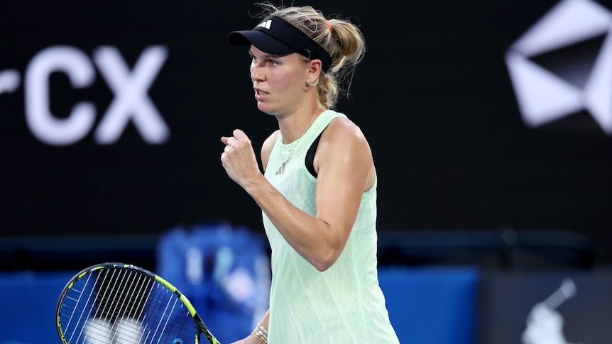 Caroline Wozniacki pumps her left fist at the 2024 Australian Open.