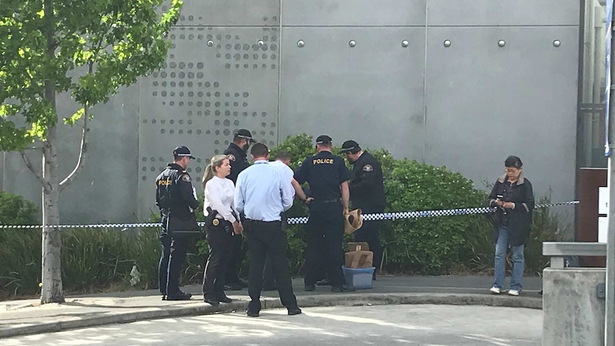 Police at the scene where a man's body was discovered at Royal Hobart Hospital, Tuesday 23 October, 2018.