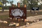 A wooden sign marks the entrance of the new Bundaberg Brewed Drinks premises