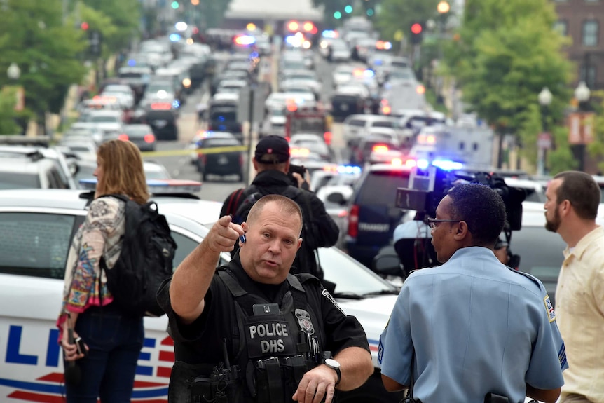 Police and emergency crew arrive at the scene at an apparent shooting at the Navy Yard in Washington, DC