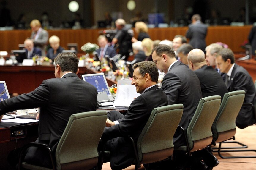 French President Nicolas Sarkozy (2ndL) attends a working session of the European Council