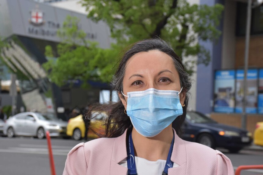 A woman wearing a face mask.