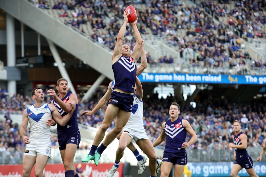 Nat Fyfe takes a pack mark for the Dockers against the Kangaroos.