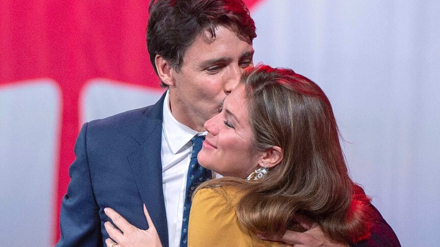 Justin Trudeau kissing the cheek of his wife Sophie.