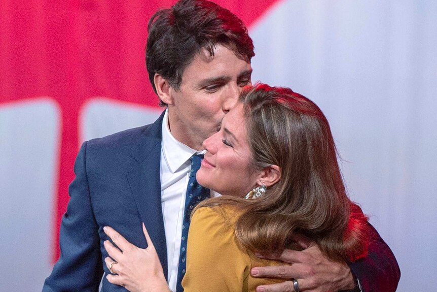 Justin Trudeau kissing the cheek of his wife Sophie.