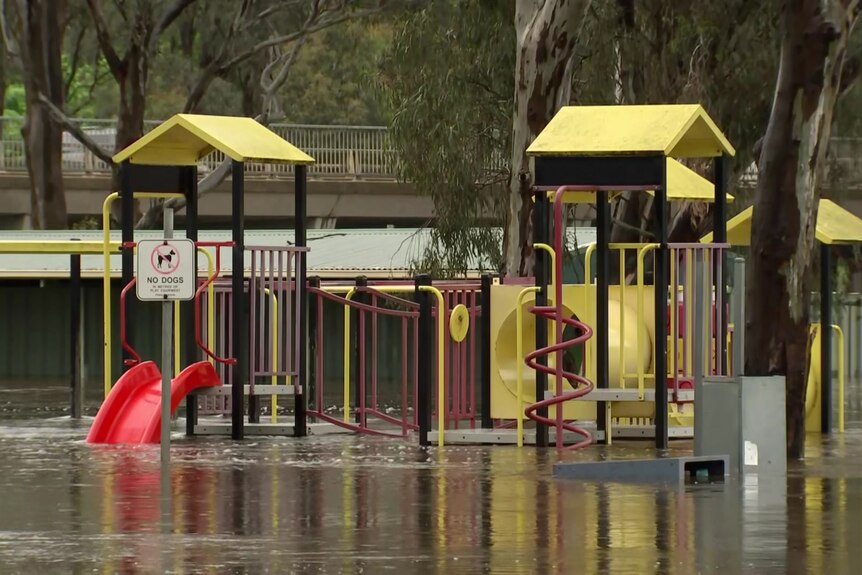 a playground submerged in flood water.