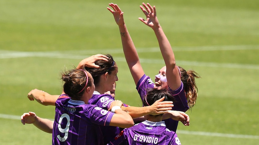 Kate Gill of the Glory is congratulated by team mates after scoring a goal during the W-League semi final match between Perth Glory and Sydney FC at Perth Oval