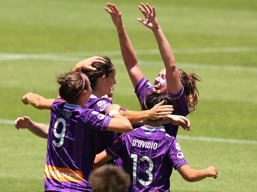 Kate Gill of the Glory is congratulated by team mates after scoring a goal during the W-League semi final match between Perth Glory and Sydney FC at Perth Oval