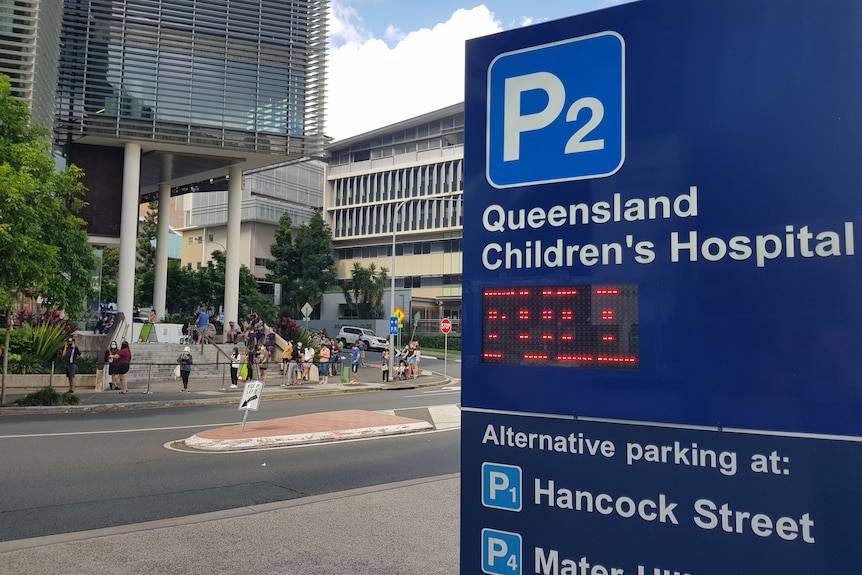 People line up for Rapid Antigen Test at Queensland Children's Hospital, in Brisbane's South Brisbane.