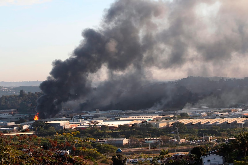 Smoke rises as a building burns near Durban, South Africa