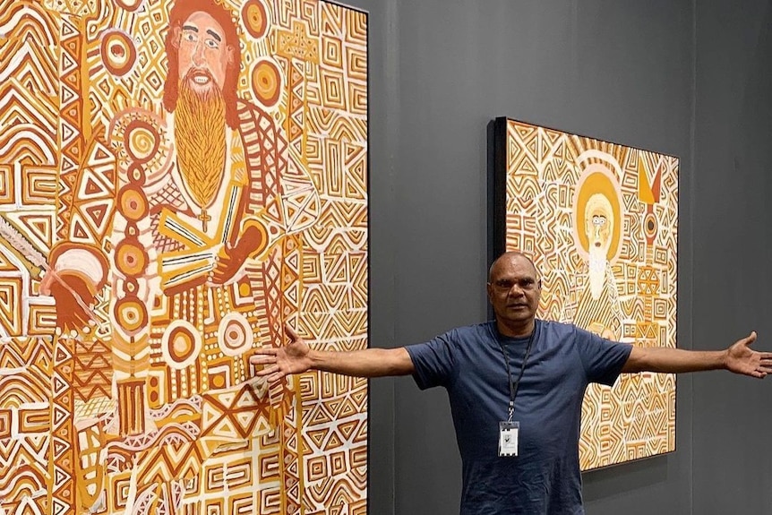Johnathon Bush stands in front of his work at his exhibition at The Armory in New York.