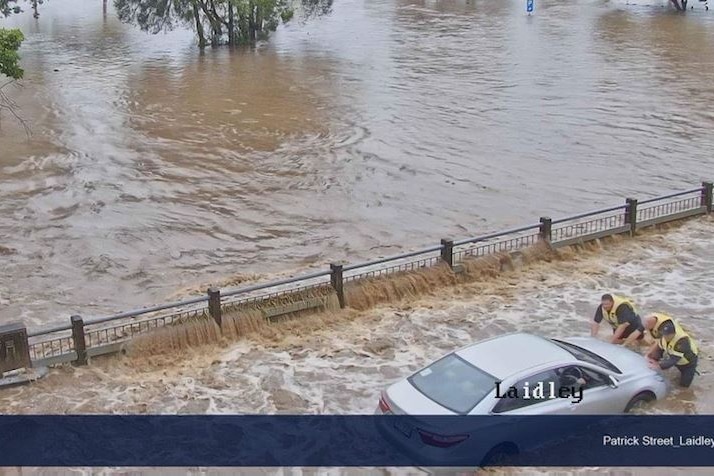 A motorist became stuck in floodwaters in Laidley this morning on Patrick Street, west of Brisbane.