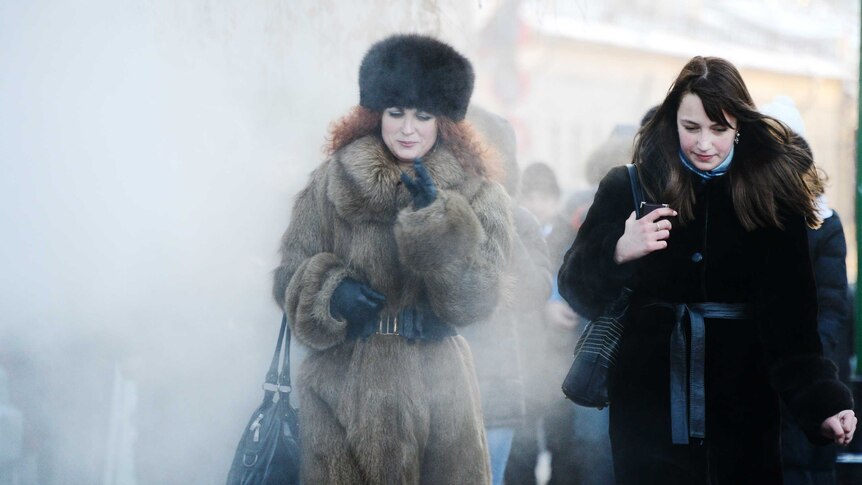 Two women brave the freezing outdoors in central Moscow, December 19, 2012.