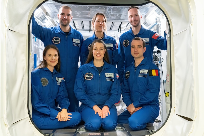 Katherine Bennell-Pegg inside a spacecraft with five other trainees.