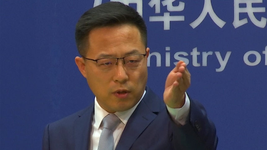 A Chinese foreign ministry spokesman gestures