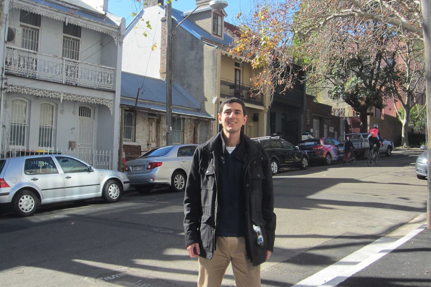 Yaz Kassisieh stands on a street in Sydney's Surry Hills.