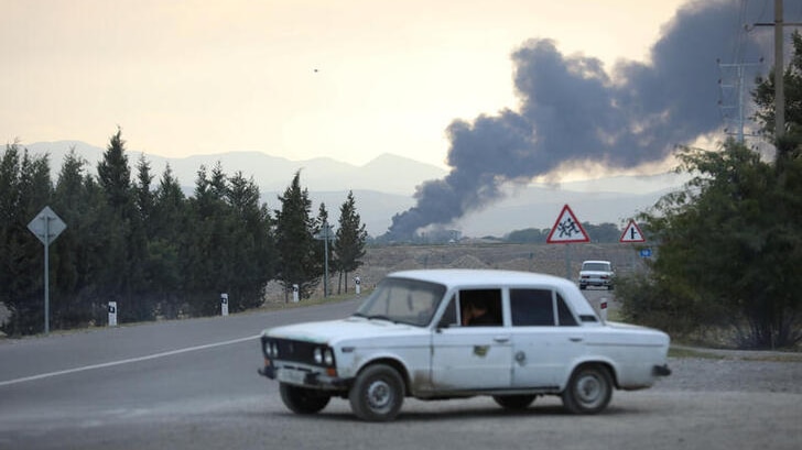 Smoke rises after alleged shelling during a military conflict over the breakaway region of Nagorno-Karabakh.