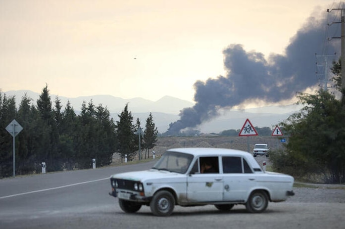 Smoke rises after alleged shelling during a military conflict over the breakaway region of Nagorno-Karabakh.