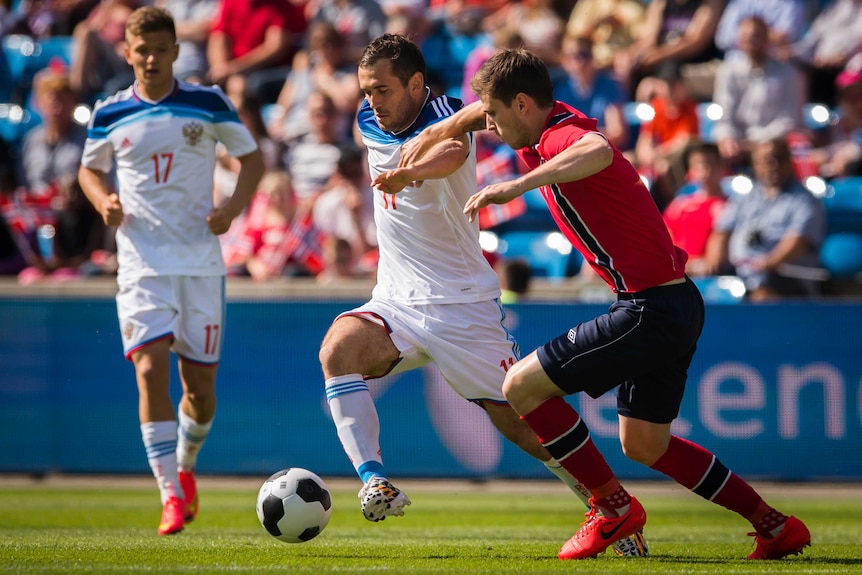 Russia forward Kershakov dribbles the ball