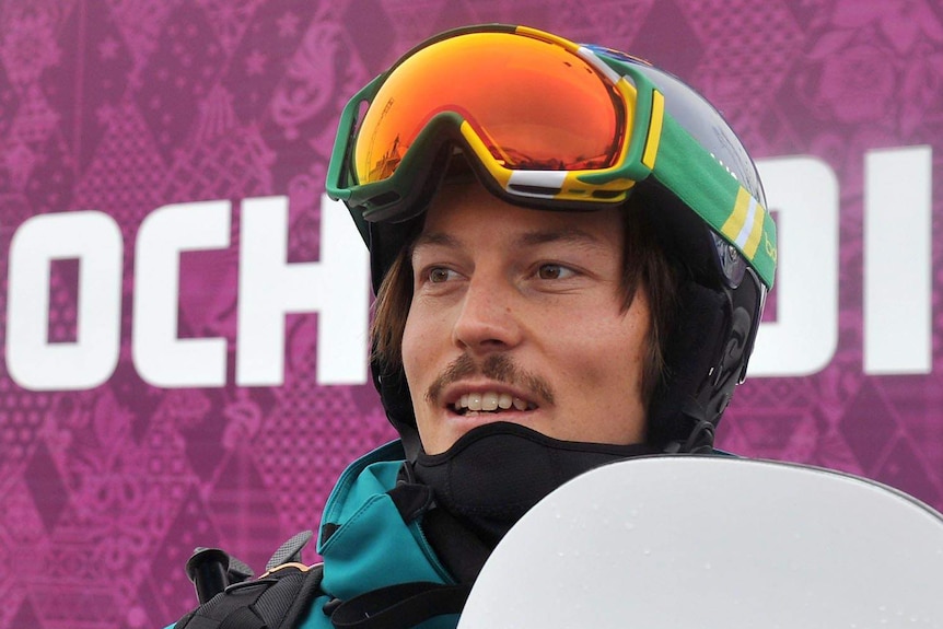 Headshot of Australian snowboarder Alex Pullin wearing helmet and goggles on his head at the 2014 Olympic Winter Games.