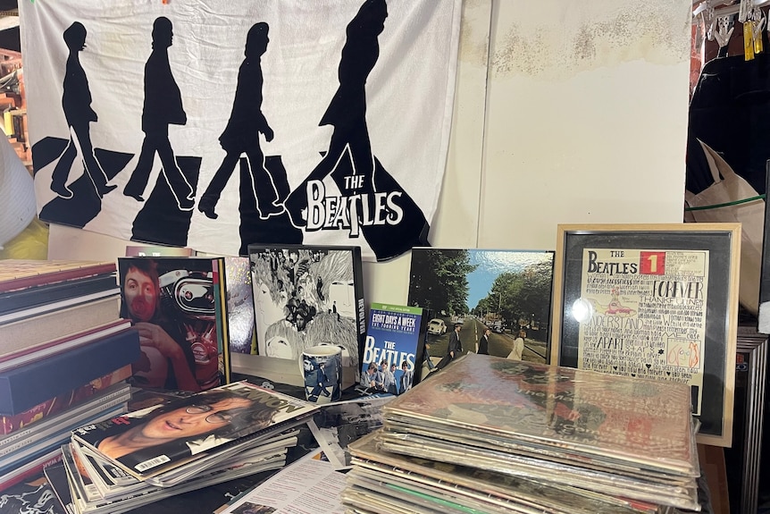 A collection of Beatles records, books, posters, towels and other memorabilia