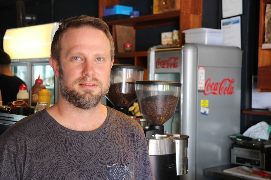 Nobby's beach cafe owner Craig Johnston in his shop on Queensland's Gold Coast.