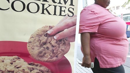 Report: Obesity rates are increasing just as quickly as our waist lines (file photo).