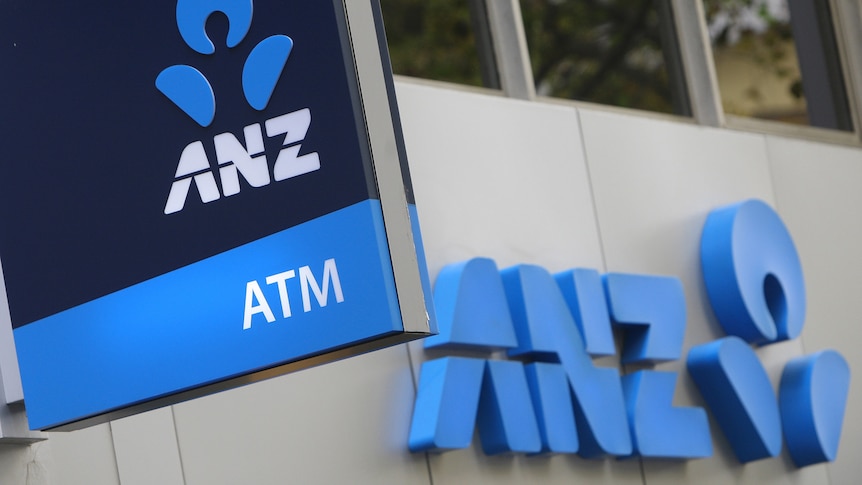 The logo of the Australia and New Zealand Banking Group Ltd. (ANZ) is displayed outside a bank branch in Sydney