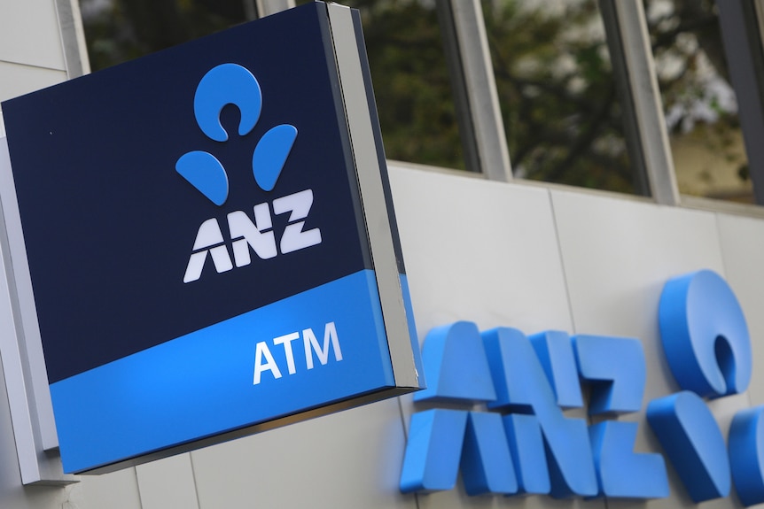 The logo of the Australia and New Zealand Banking Group Ltd. (ANZ) is displayed outside a bank branch in Sydney