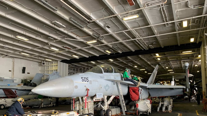 An aircraft on board USS Ronald Reagan undergoing maintenance