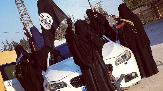 Women wearing burquas pose on a white BMW with machine guns.