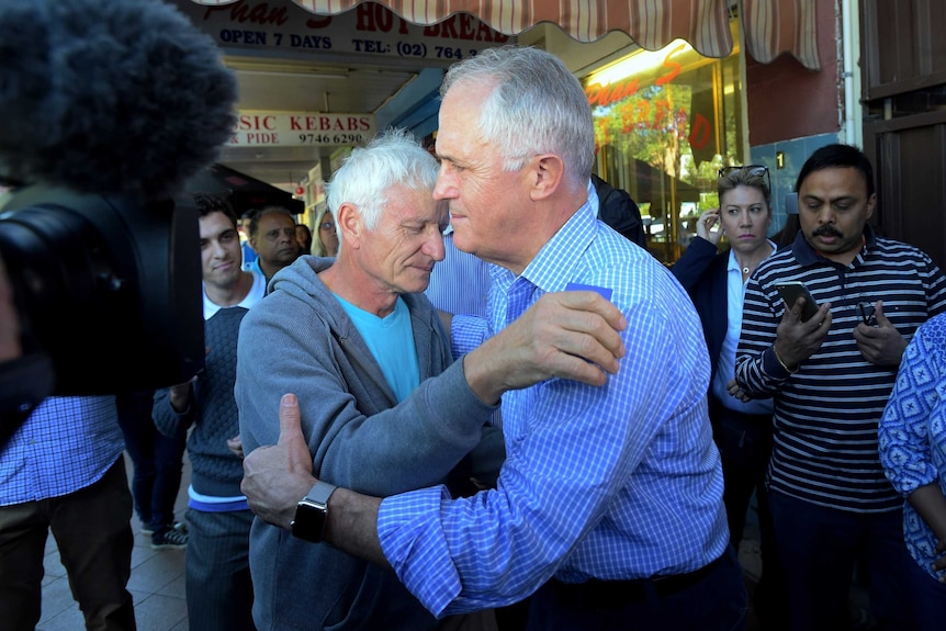 Malcolm Turnbull hugs Serge Oreshkin