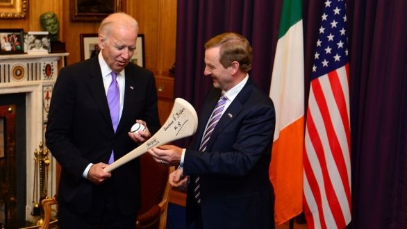 Joe Biden meets with Enda Kenney, the Irish taoiseach, in front of an Irish and an American flag.